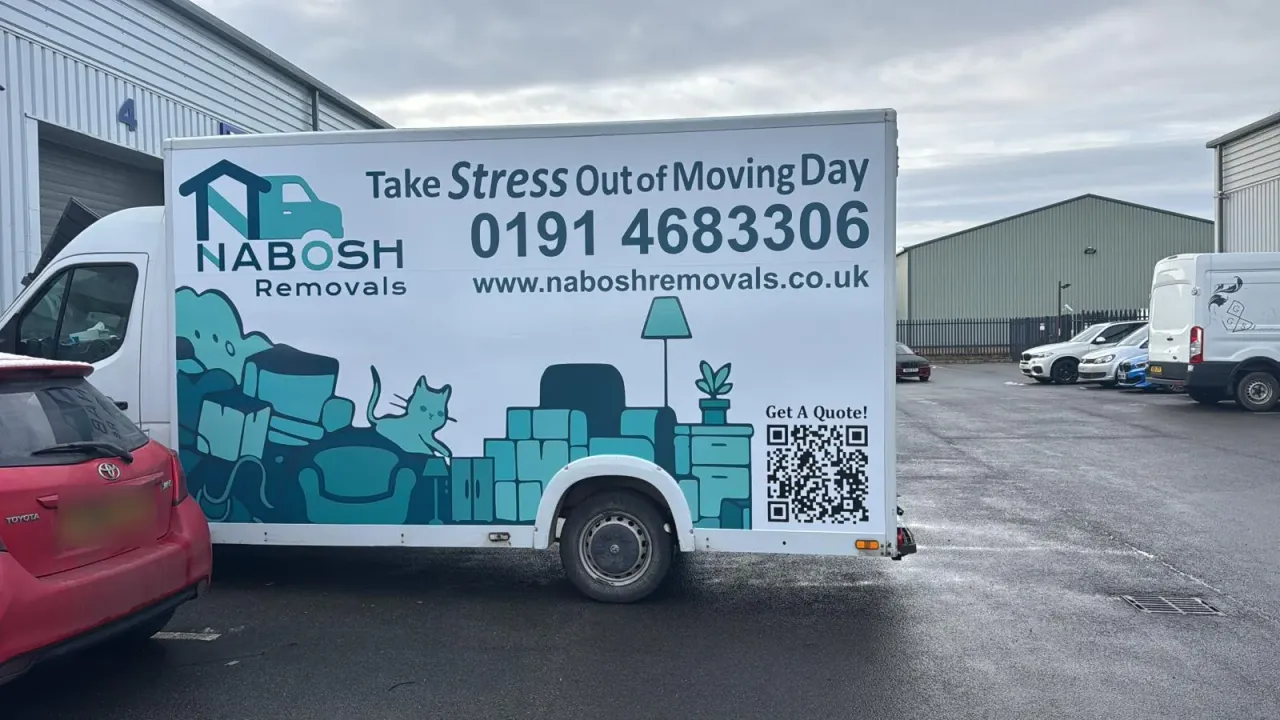 A Nabosh Removals Luton van on an industrial estate, its side printed with the logo, the phone number 0191 468 3306, the website address and a QR code