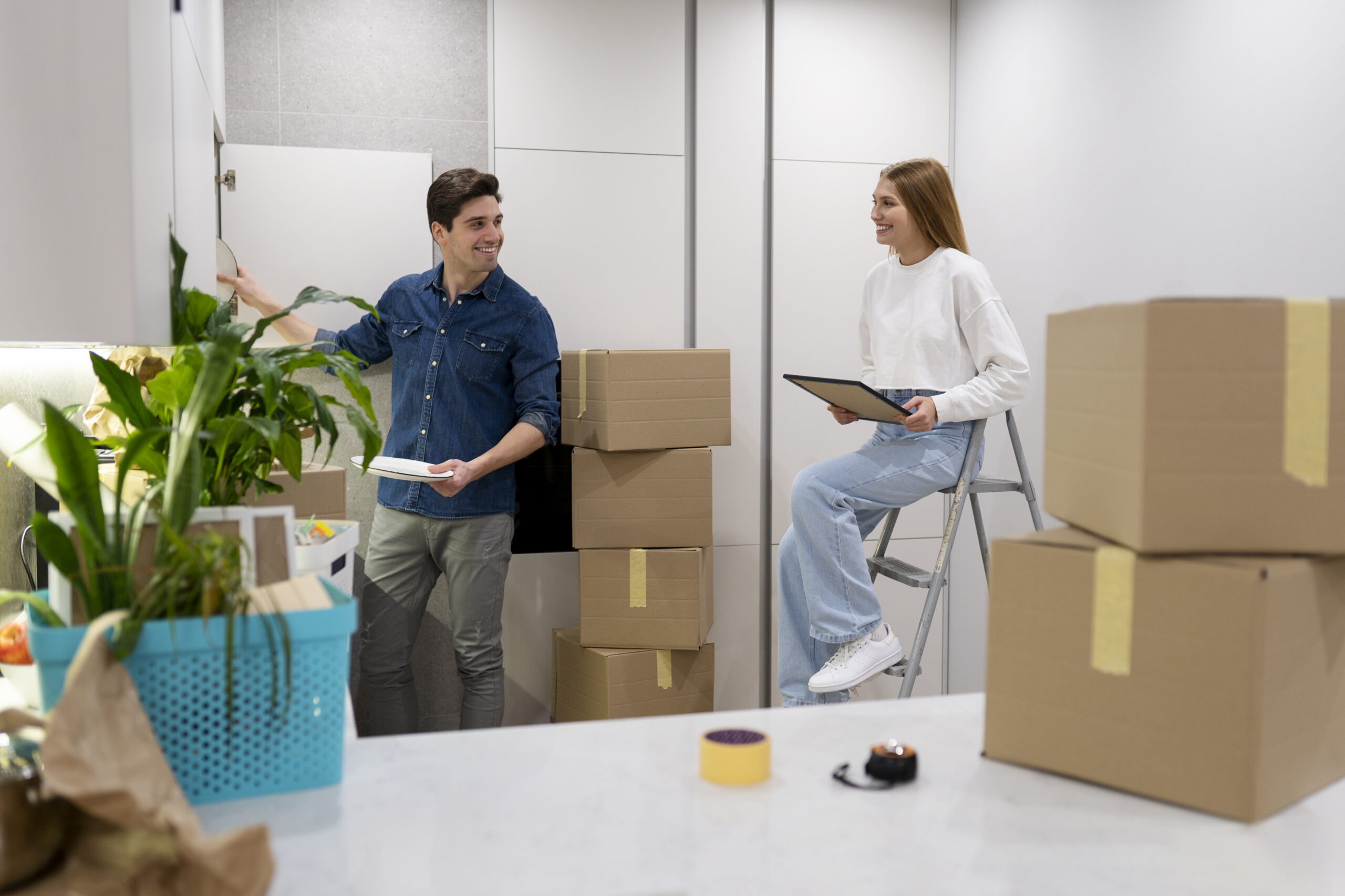 Colleagues in an office with packed boxes